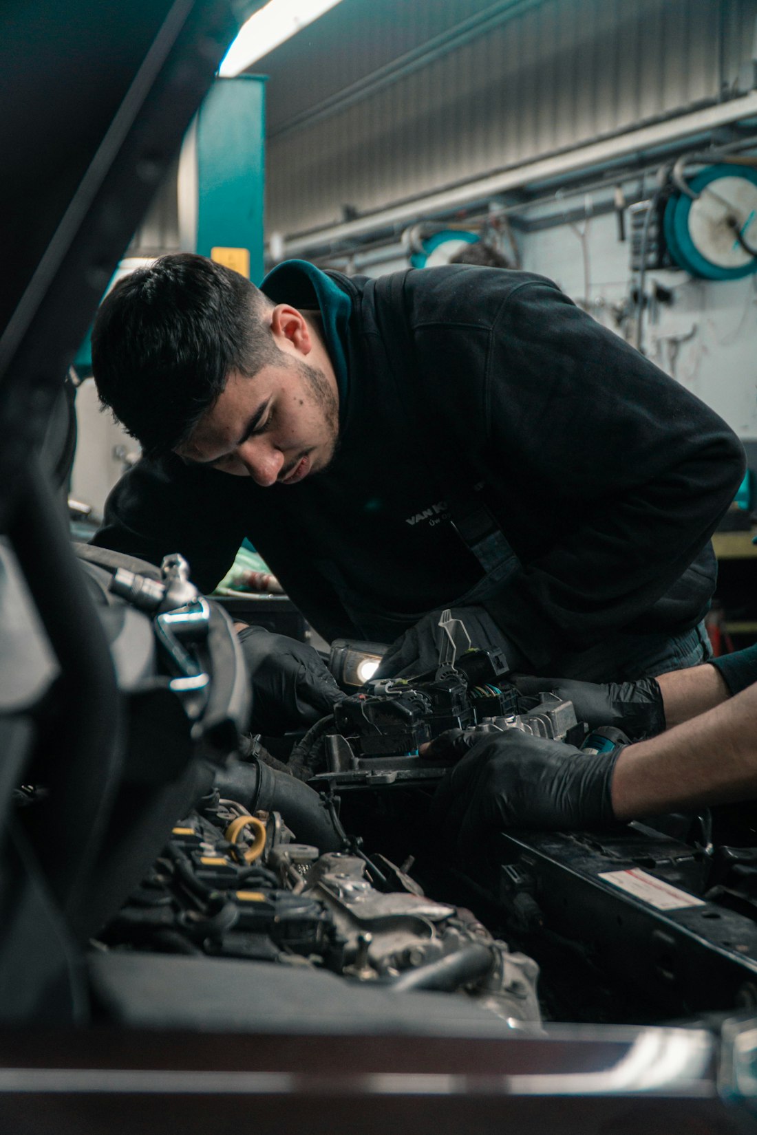 A technician learning to fit vehicle electronics